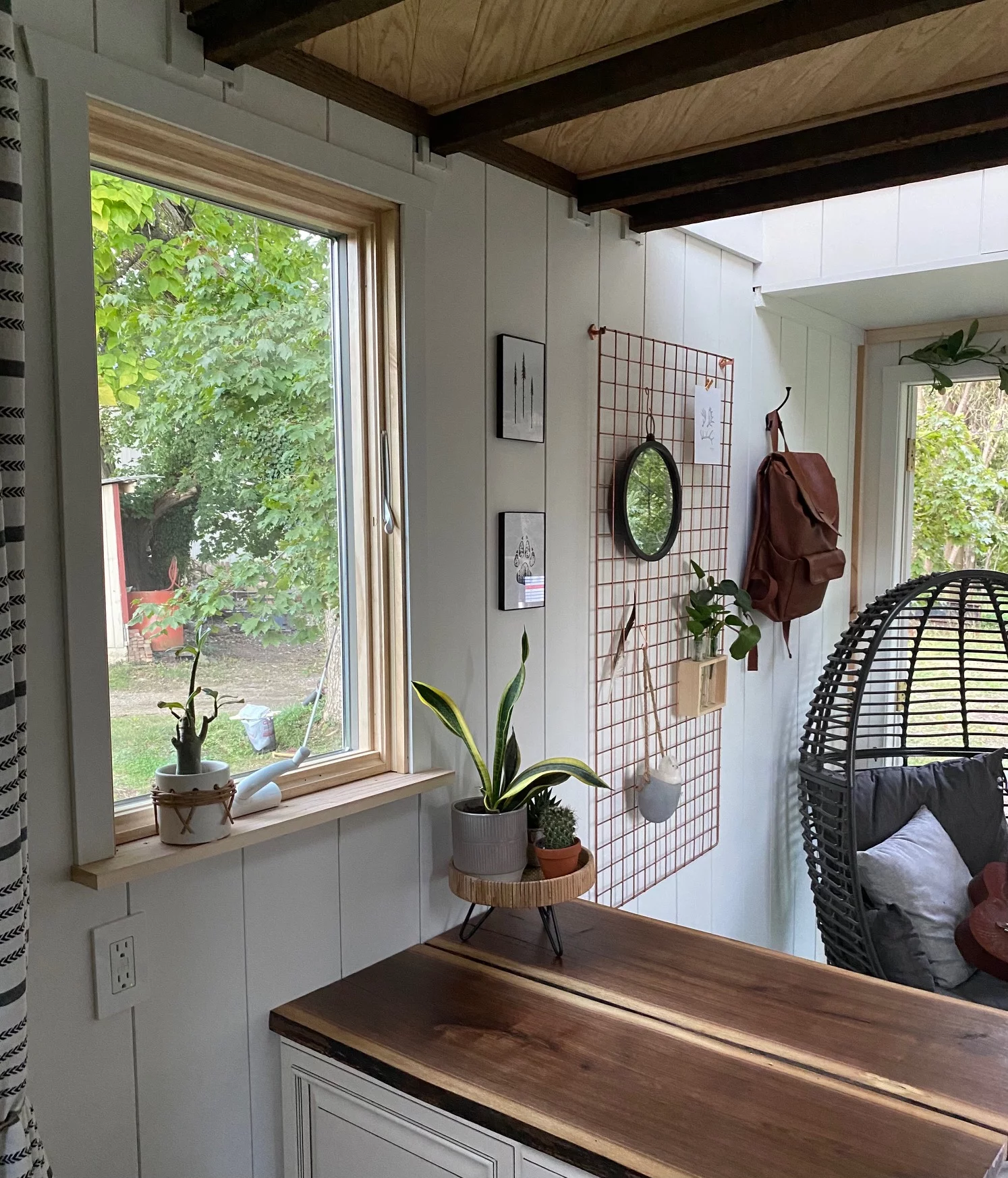Inviting nature into the home’s principal living quarters was a key design feature to making this tiny home work