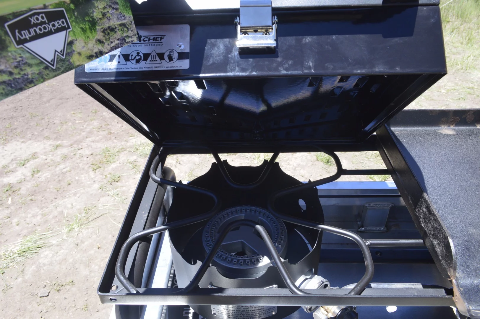 The grill and griddle remove to reveal a standard two-burner stove