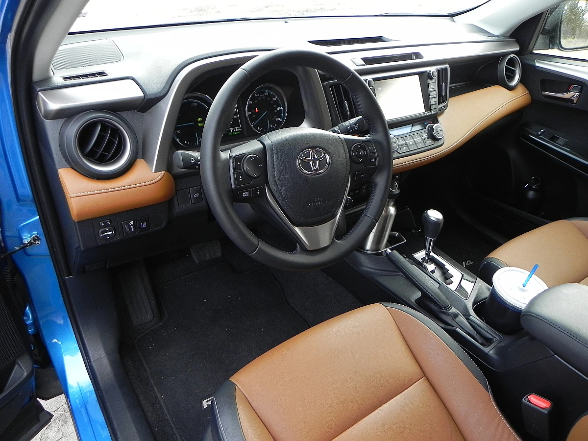 The up-lifted dashboard, with added utility tray, is perfect for gadgets and odds and ends, and the smart placement of pass-throughs for the wiring and plugs that accompany those gadgets is very ergonomic