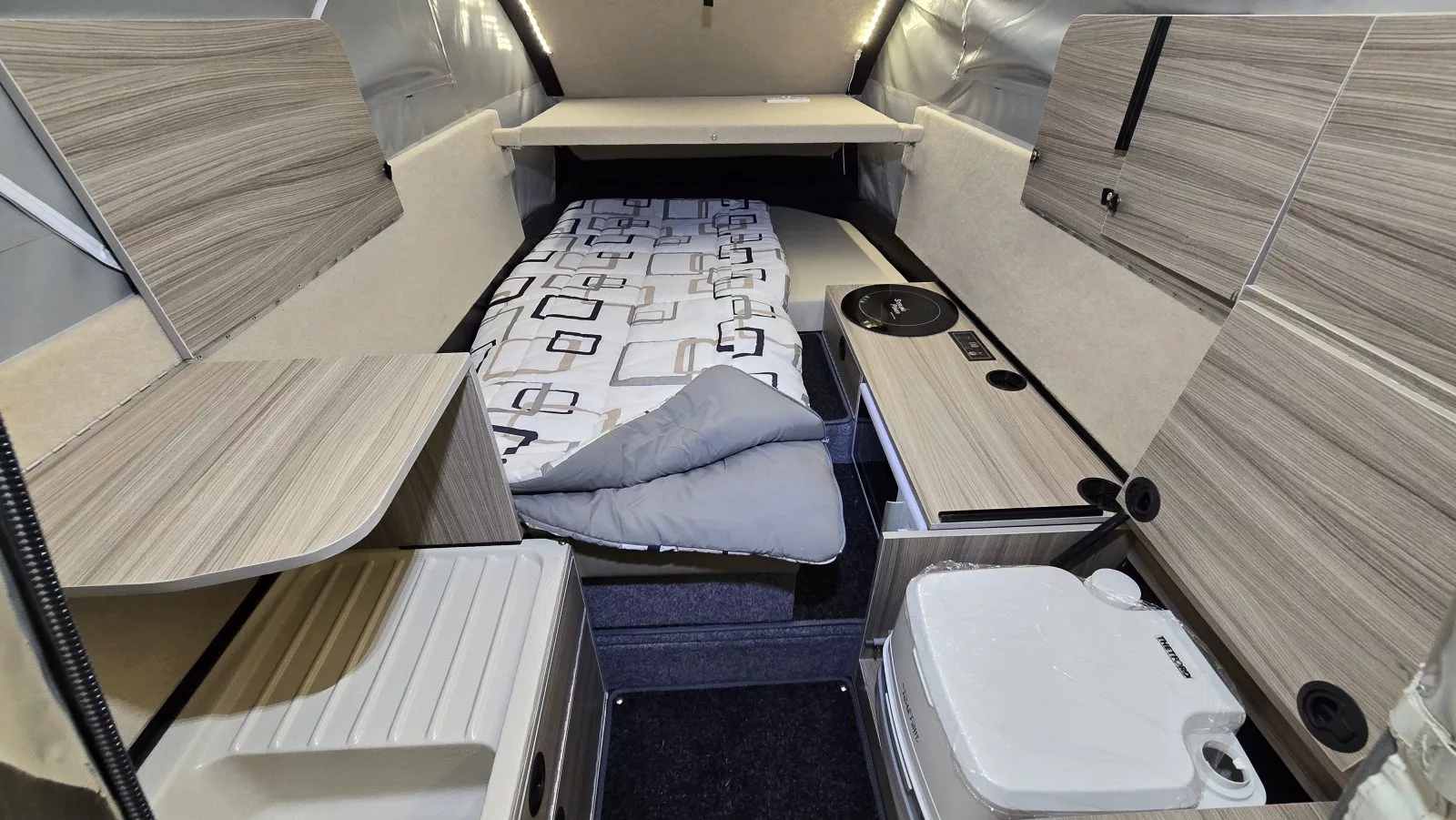 This interior pic of the Dashaway ECTS shows the fixed kitchen area and toilet cubby with hinged lid
