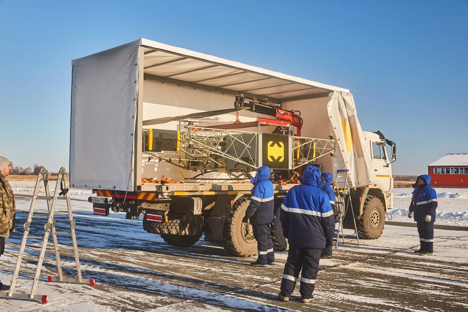 Workers prepare the Skyf drone for demonstration