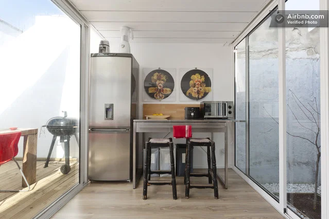 The home has been stylishly decorated throughout, while the ceilings are the only evidence of its shipping container structure