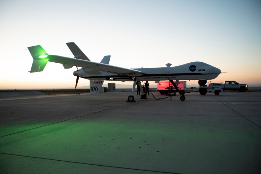 Aircraft maintenance crews at NASA‘s Armstrong Flight Research Center prepare the remotely-piloted Ikhana aircraft for a test flight June 12, 2018