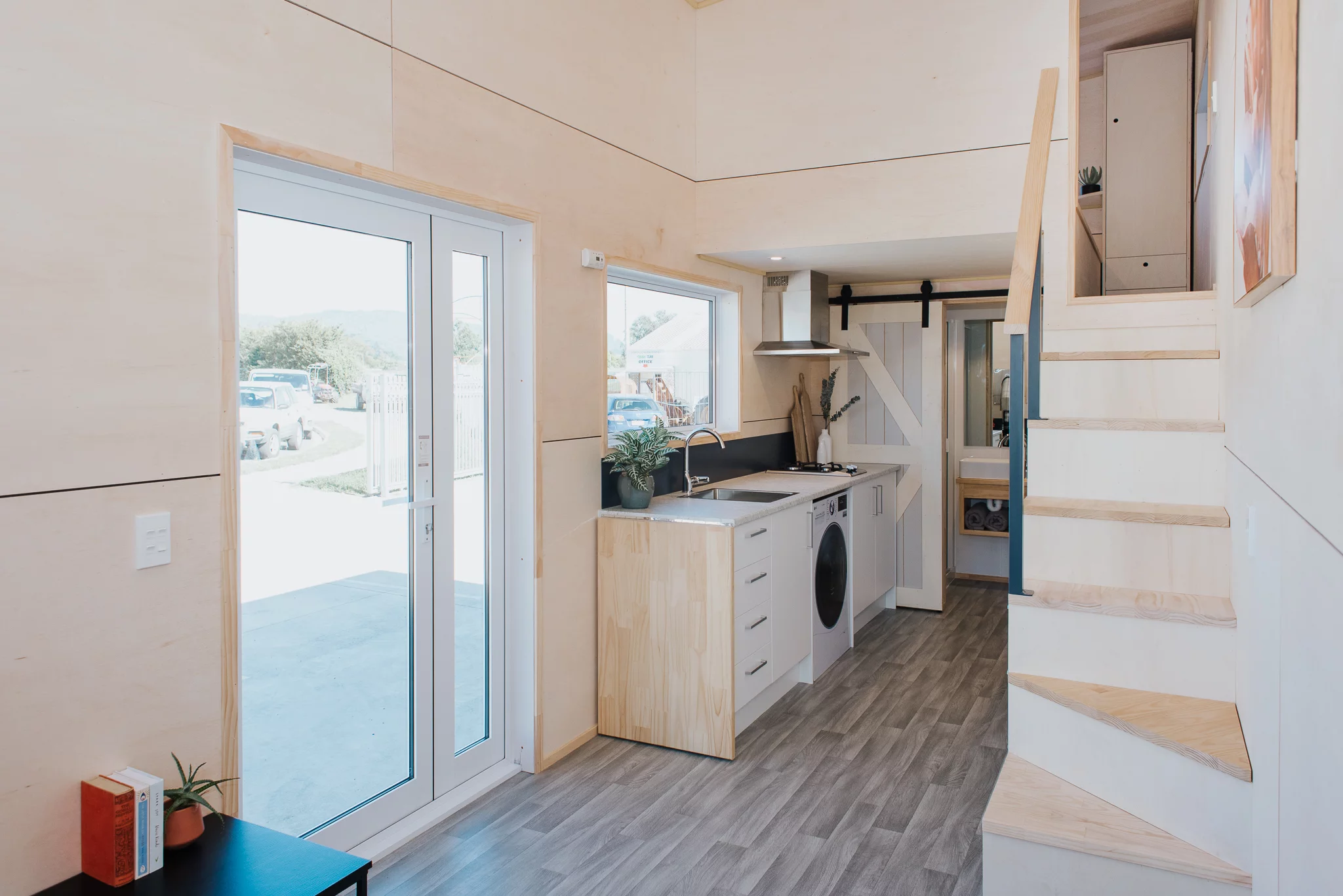 The Purple Palace is accessed through a large glass door that adds to the daylight inside and helps mitigate the lack of windows