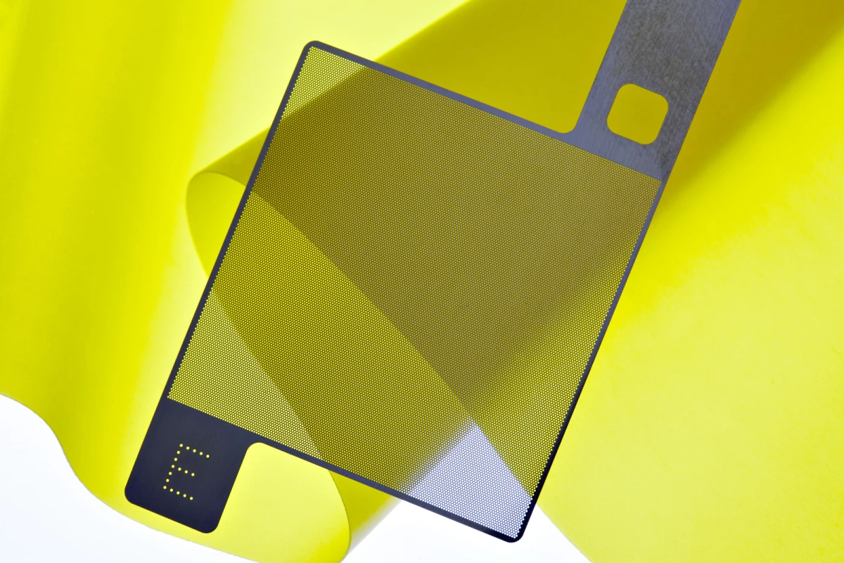 An illustration depicting one of the lattice-like electrodes, over top of one of the elastomer sheets