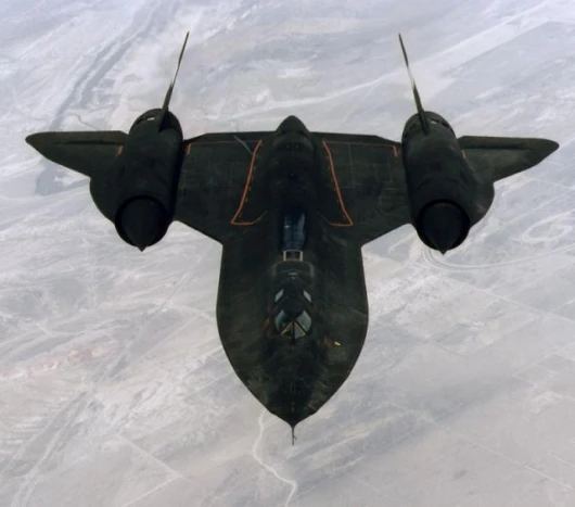 An air-to-air overhead front view of an SR-71A strategic reconnaissance aircraft.
