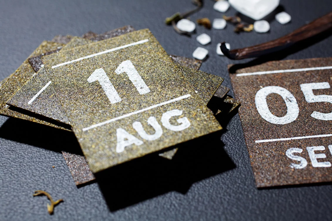 Each date of the Hälssen & Lyon tea calendar is printed on a thin square of compressed tea leaves