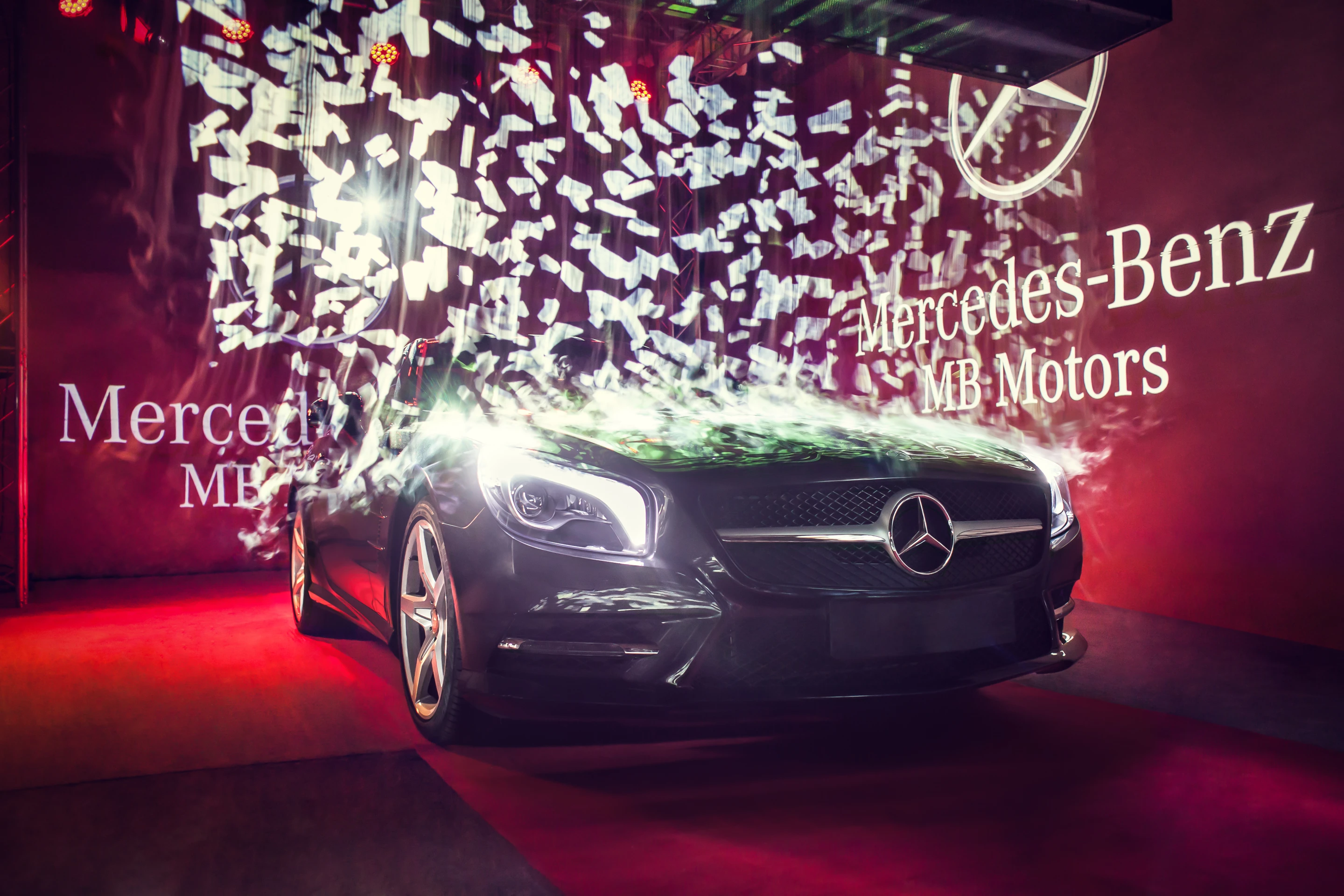 A Mercedes shown "breaking" through the screen