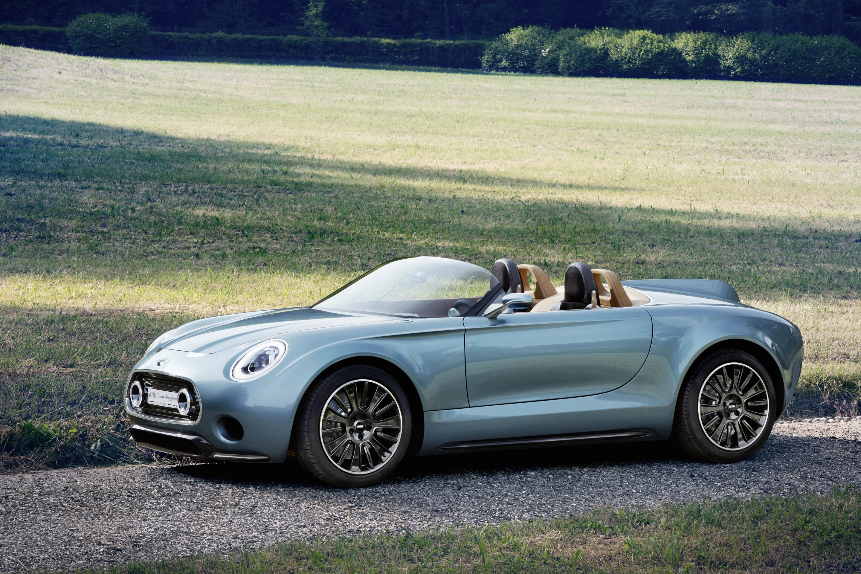 By using hand formed aluminum sheets Carrozzeria has produced a wonderfully sculpted, shortish roadster that evokes a number of design influences and eras
