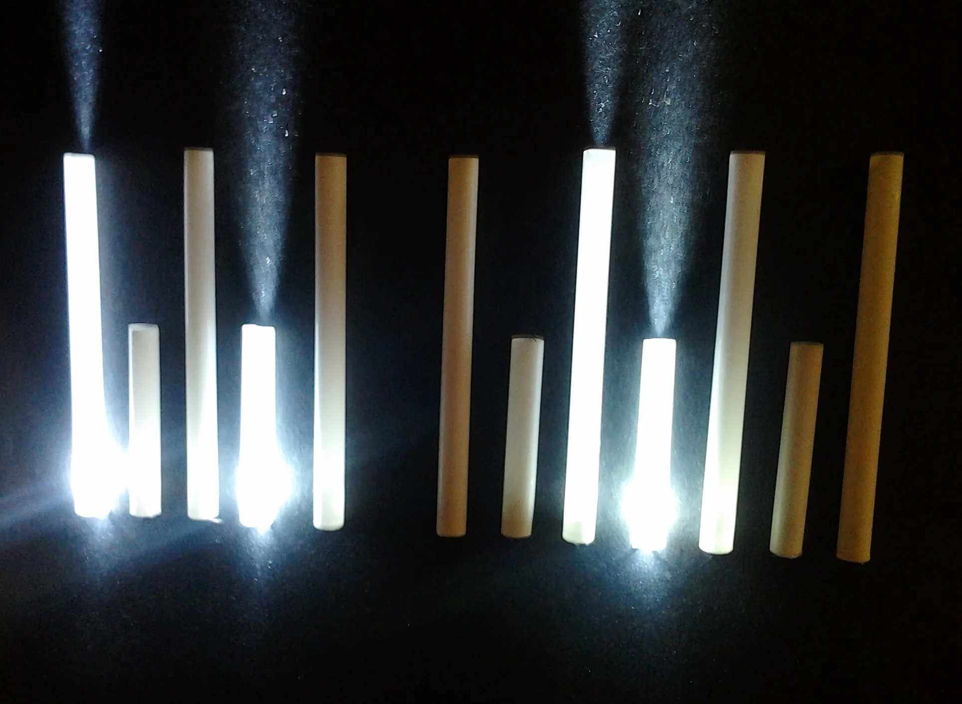 When the user touches the paper-covered copper tape, a corresponding LED lights up on the vertical panel to the rear