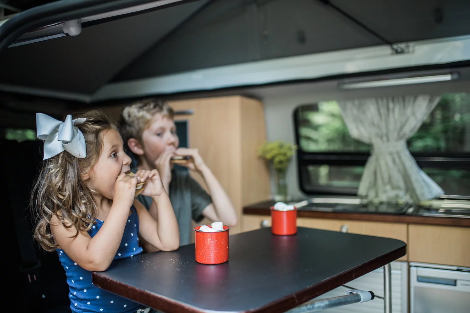 Mealtime inside Peace Van's full camper van conversion