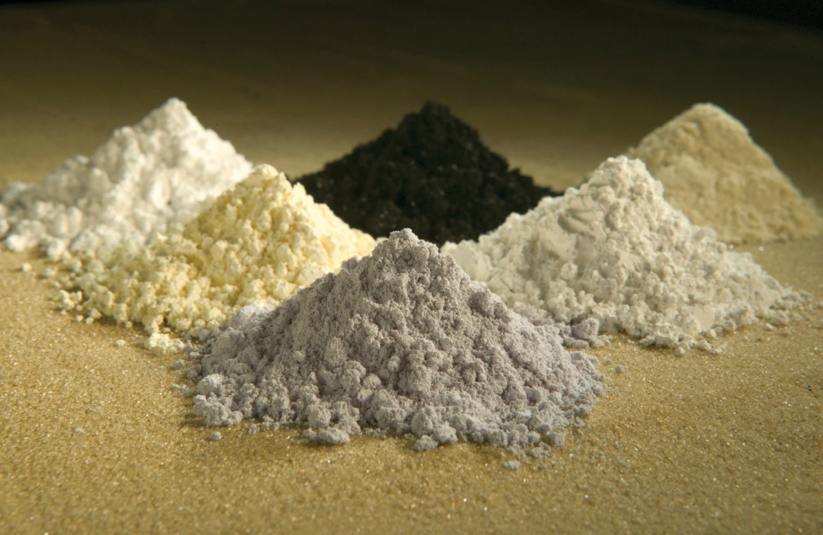 A collection of rare-earth oxides, clockwise from top center – praseodymium, cerium, lanthanum, neodymium, samarium, and gadolinium
