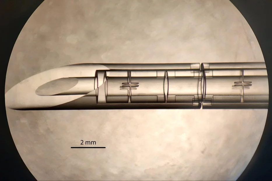 A microscope image of the ARC needle, showing its beveled rigid outer tube and its flexible articulated inner tube