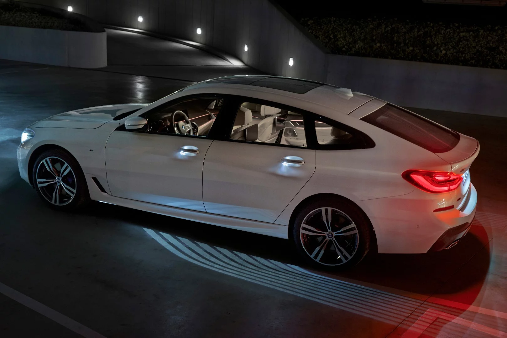 The lighting on the ground is designed to welcome people to the interior of the 6 Series Gran Turismo