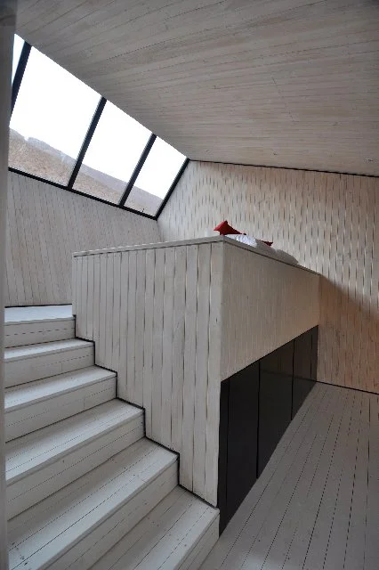 Each cabin is slightly raised above the ground and features a graded interior design