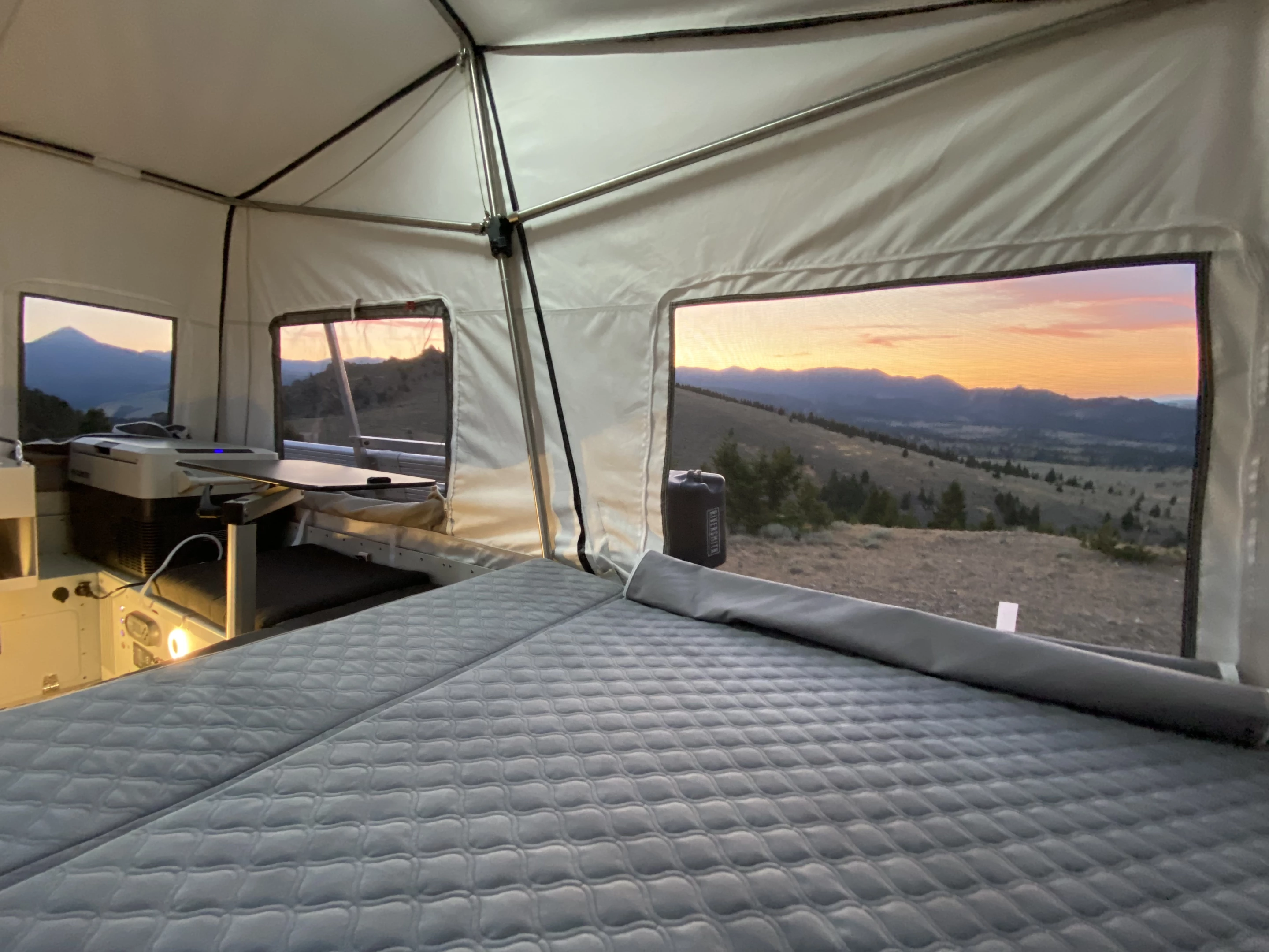 The Skinny Guy camper sleeps two on the bed that extends out off the back