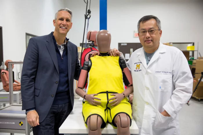 Humanetics CEO Christopher O’Connor and Michigan Medicine trauma surgeon Stewart Wang with the new elderly crash test dummy