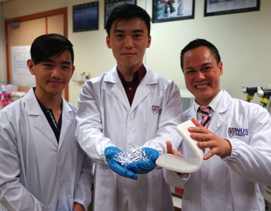 Assistant Professor Duong Hai Minh (right) holds a sample of the cellulose aerogel which he developed with his team members, Gu Bowen (centre) and Siah Jie Yang (left) who are both undergraduate students from the Department of Mechanical Engineering
