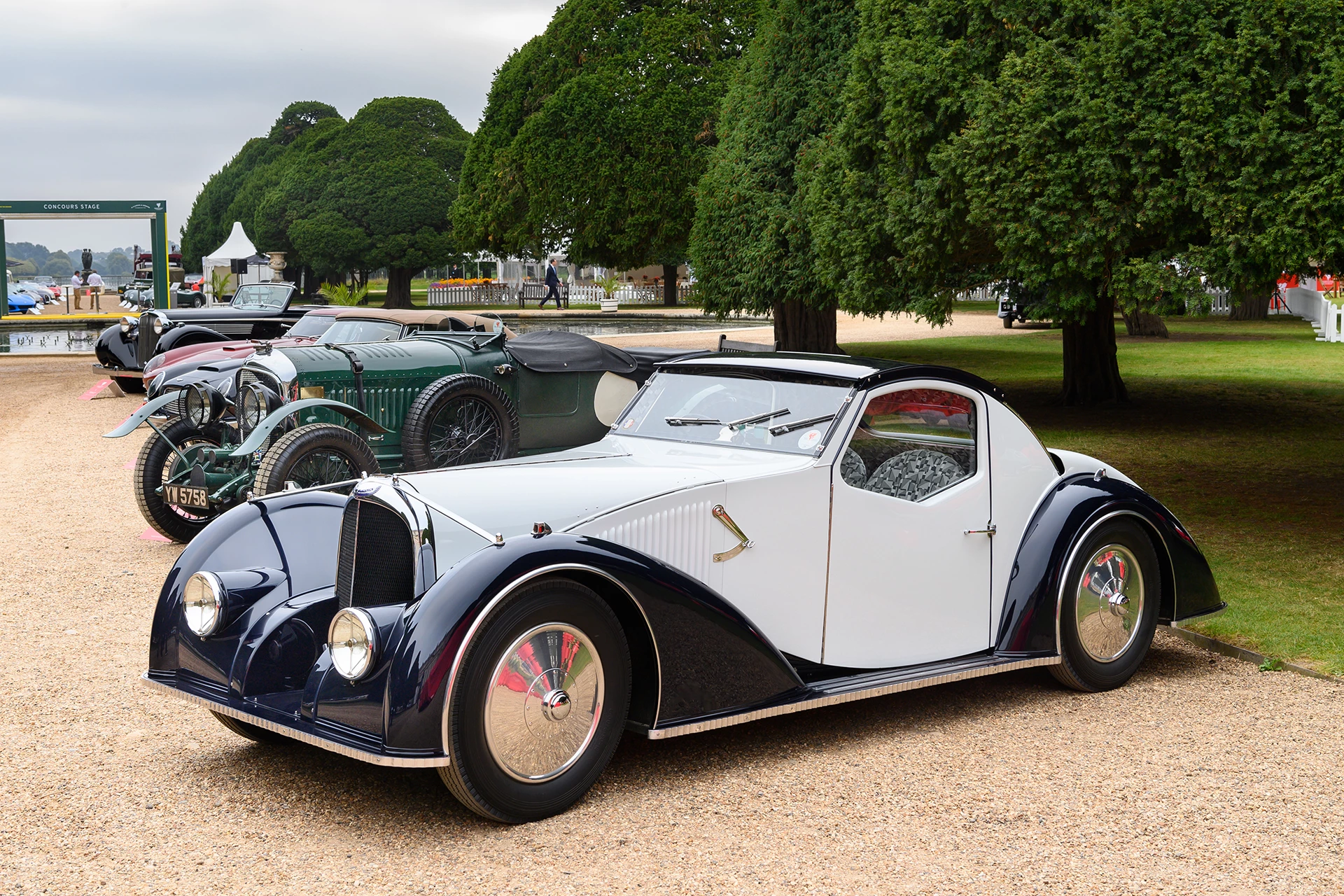 The 2021 Concours of Elegance presented by A. Lange & Söhne was held at Hampton Court Palace with the prestigious "Best in Show" award going to a unique art deco rolling sculpture known as the Voisin C-27 Aérosport of Merle and Peter Mullin. The Mullins have a collection of the finest French cars in the world including some priceless Bugattis, Citroens, Delahayes, Delages, and Peugeots. If you are in California, be sure to check out The Mullin Automotive Museum in Oxnard, California, US. Established in 2010, it displays over 100 vehicles from the collection