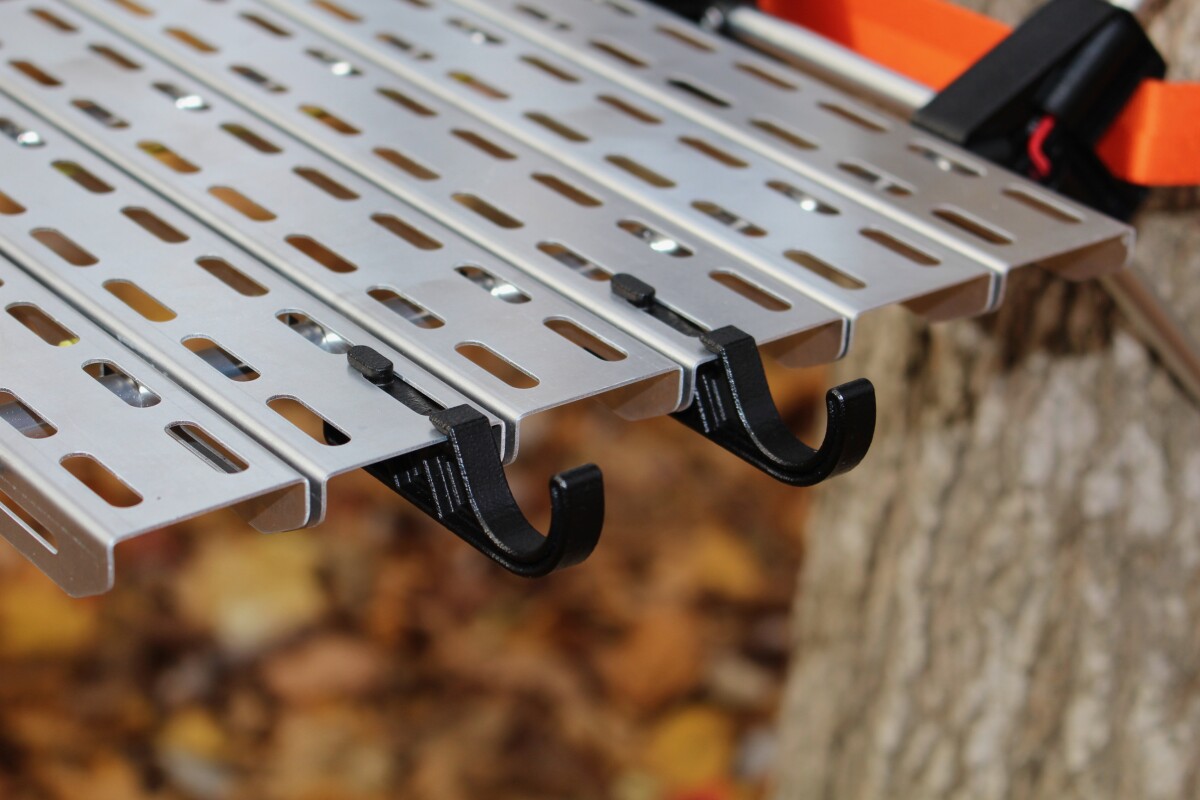 Legless camping table stashes like a water bottle, clings to the trees