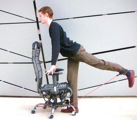 When a user gets out of the chair, the wheel locks automatically engage to limit the movement during standing exercises