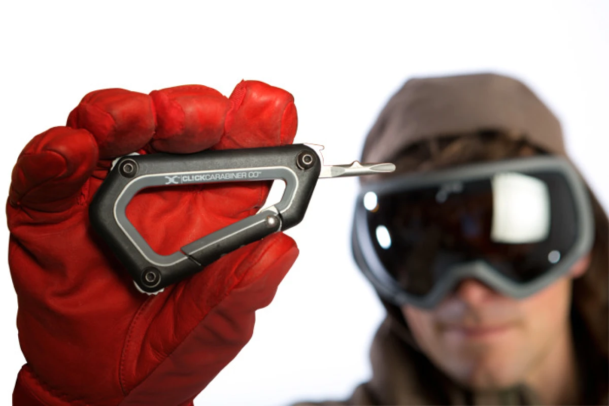 The CL!CK Carabiner is a tool designed to let skiers and riders make repairs on the hill