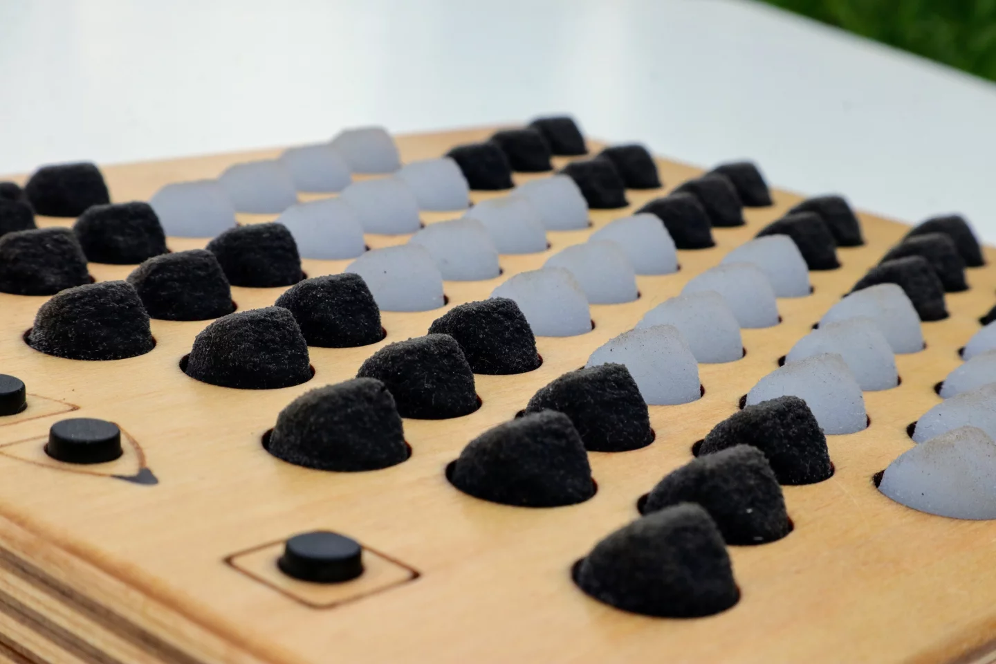 The soft silicone buttons raise to a ridge and are pressure and direction sensitive