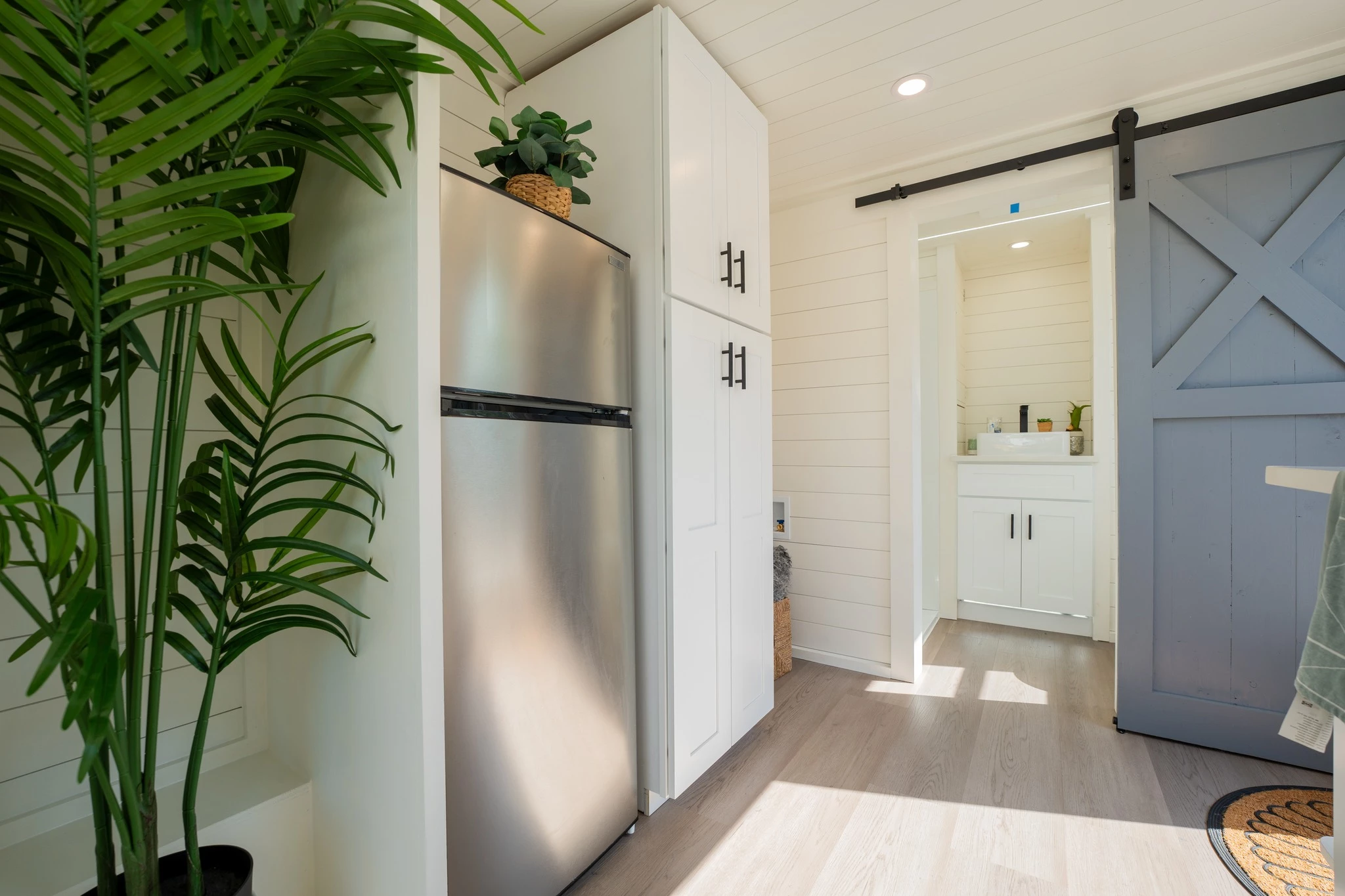 The Aria 24's bathroom is reached from the kitchen by sliding barn-style door
