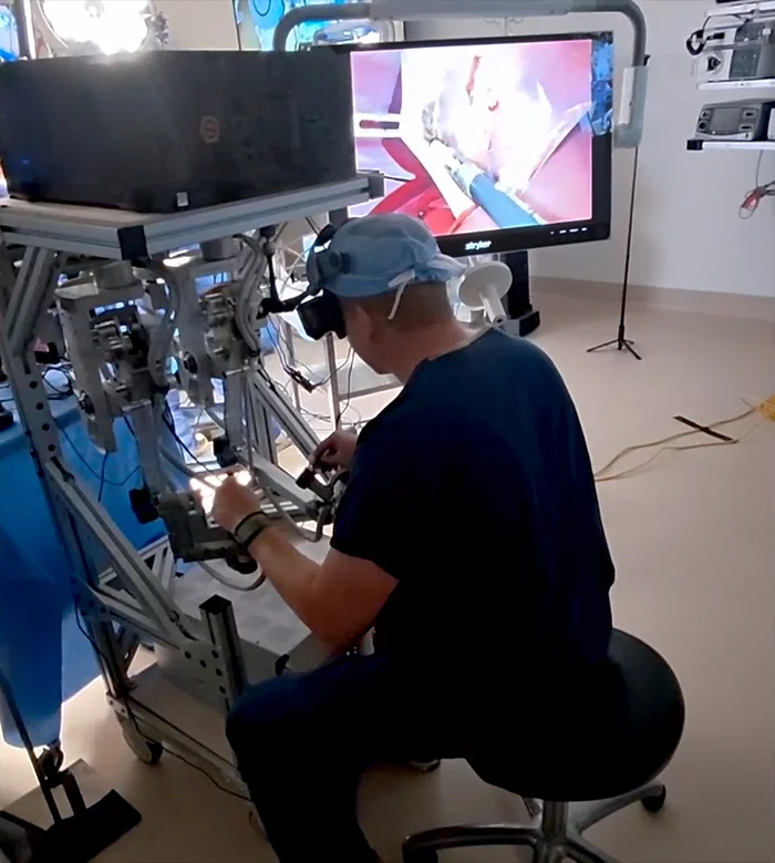 Dr. Ryan Broderick controls a robot during a gallbladder removal procedure