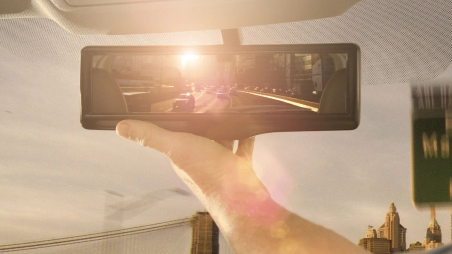 Nissan's smart mirror. In conditions where glare is a problem, such as dawn, dusk and with a tailing car with headlights on high beam, the image processing software can provide a clearer picture by modifying the image.