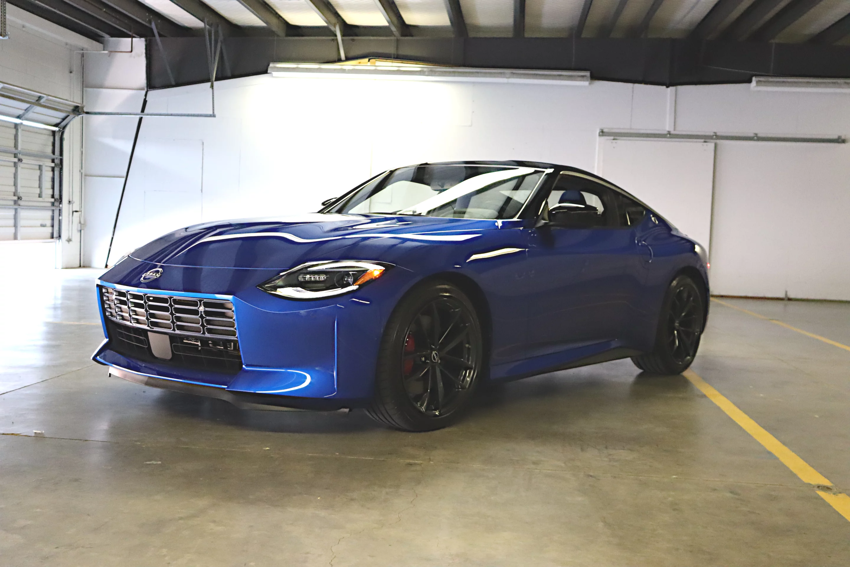 It's not seen, but the car's design includes enhanced body rigidity around those wider front tires and behind them is a new geometry for the double wishbone aluminum suspension