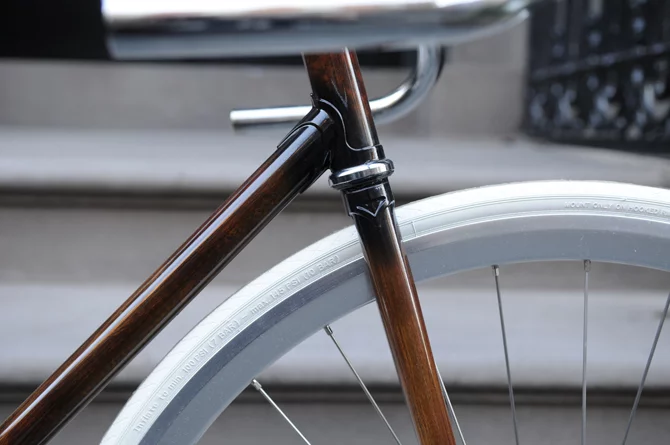 New Zealand's Rob Pollock hand-paints clients' bicycle frames with a faux woodgrain finish