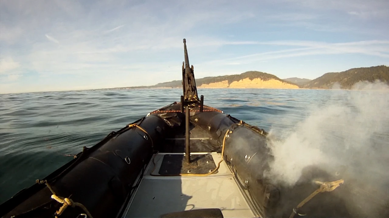 The Lockheed Martin ADAM laser system burns through the hull of a military-grade boat