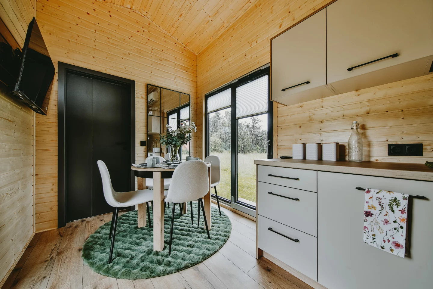 The Alan's dining area is positioned at the center of the home and functions as a general living space