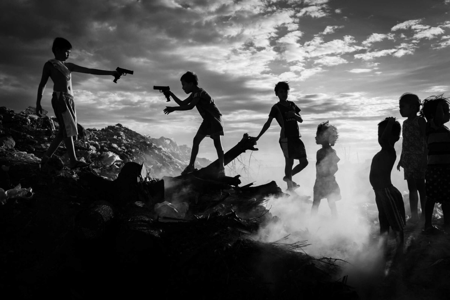 Finalist in The Photojournalist category of the 2018 EyeEm Awards. From the photographer: "I was amazed to see these children who were playing on a dumpsite in the middle of Paranaque City (Phillipines). They were totally oblivious to the hazards of their recreation. Indeed, a poignant reminder of how these children are able to find ways to enjoy their childhood even in the most distressing environments like this.