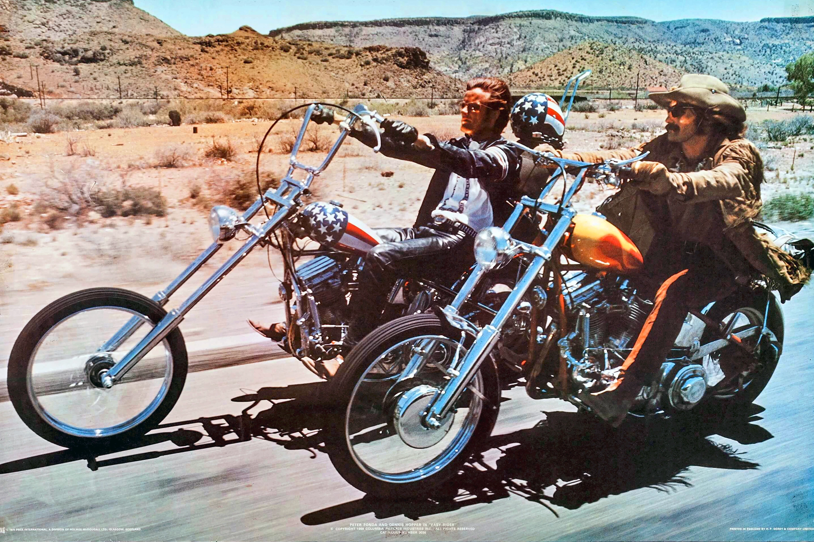 The Easy Rider Captain America bike ridden by Peter Fonda as Wyatt at left and at right, Dennis Hopper as Billy.