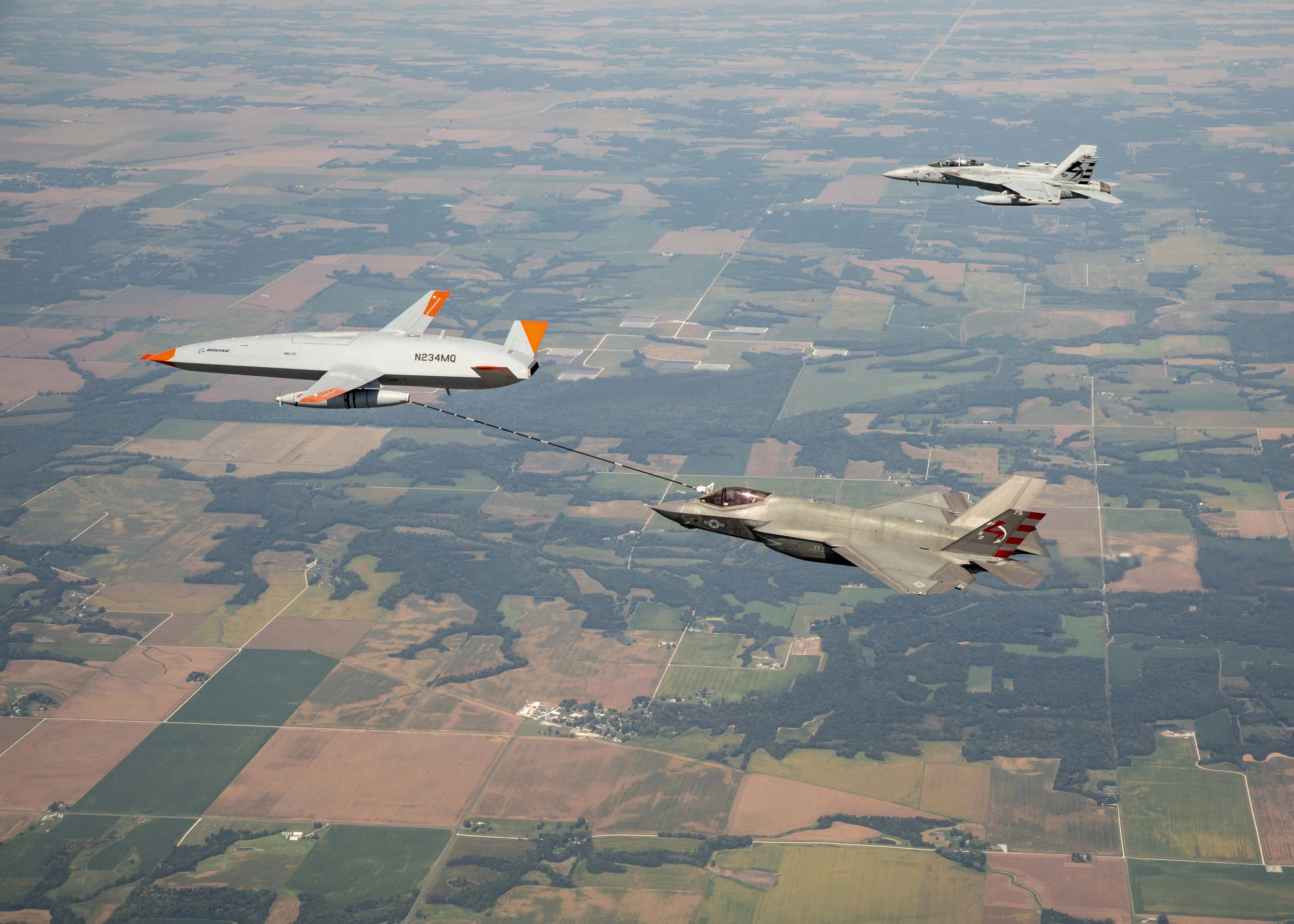 The MQ-25 and F-35C seen with a chase plane