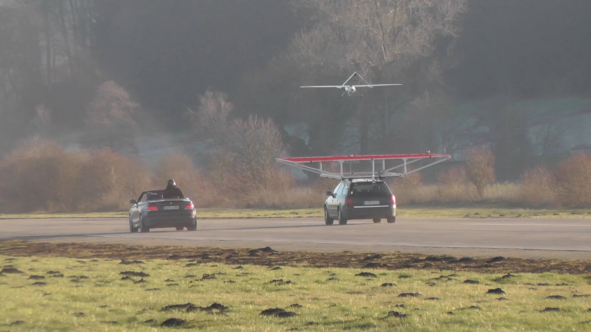 The drone coming in for an autonomous landing on a moving vehicle