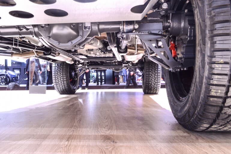 The portal axles raise the entire chassis and body up, increasing ground clearance