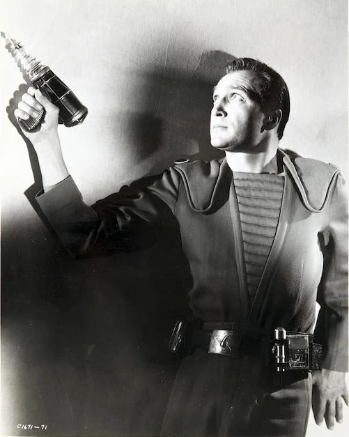 Production still of the blaster pistol in action