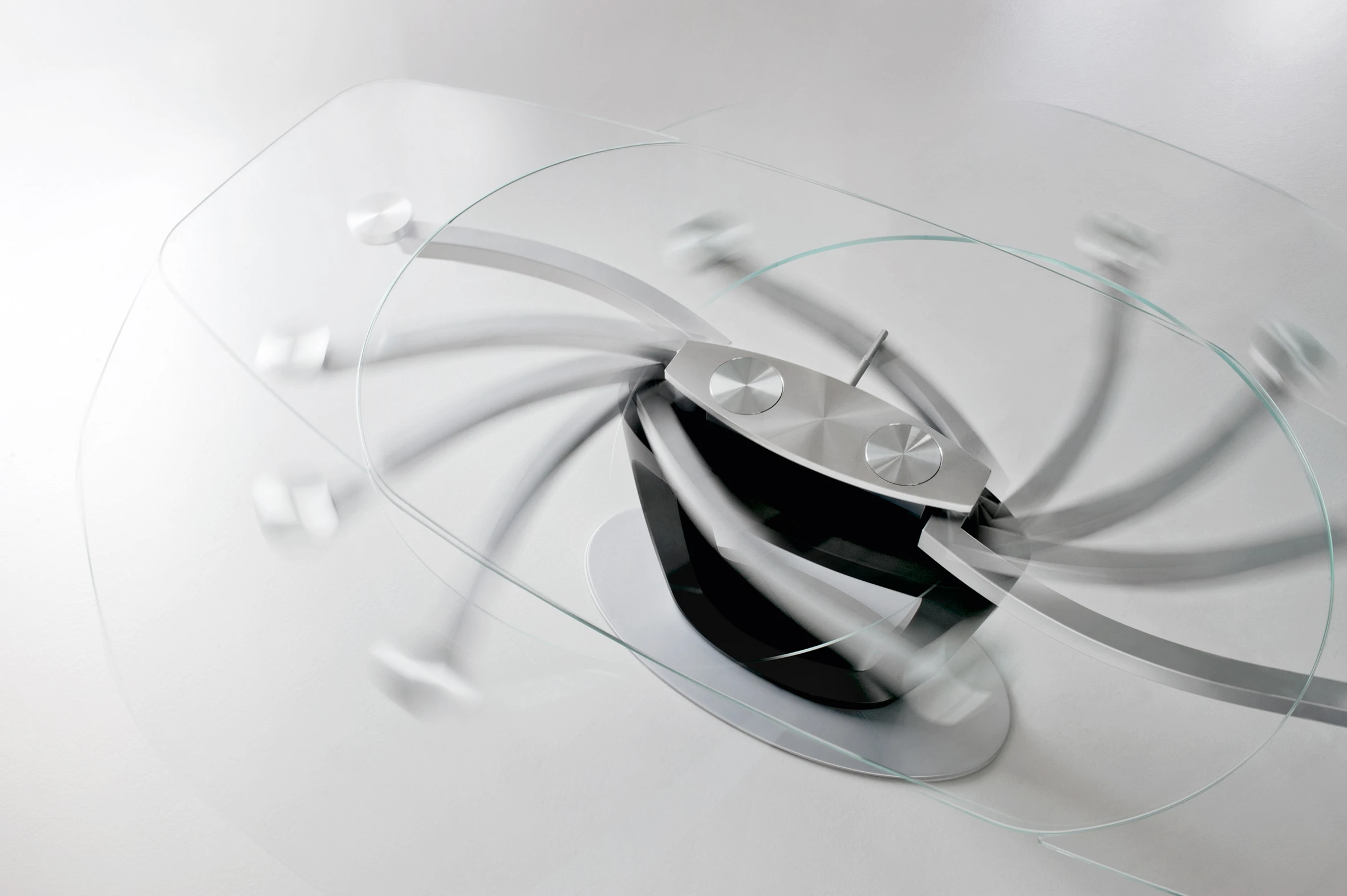 The glass top on the 2011 Calligaris Orbital table reveals its innovative extension mechanism