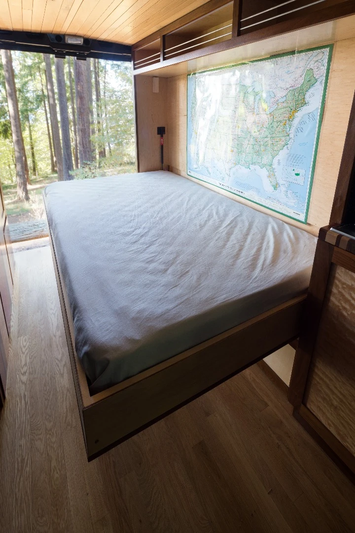 The 60-sq ft (2.15-sq m) interior features a double fold-down Murphy bed