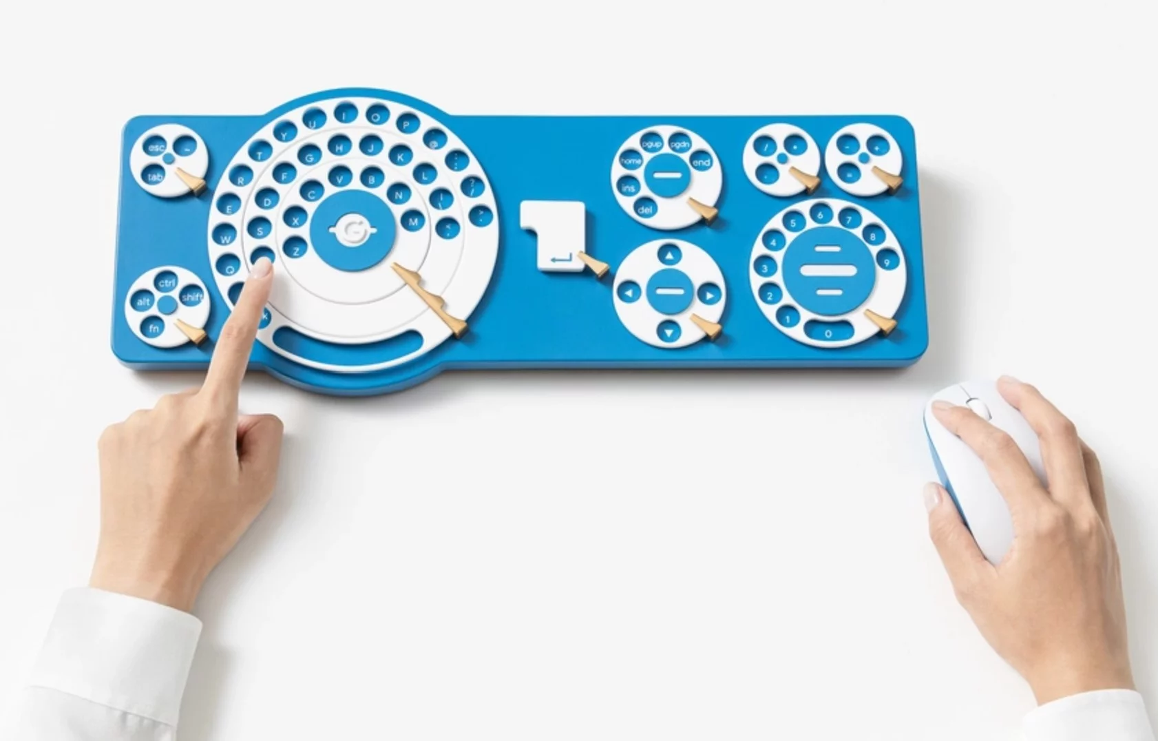 Each letter from the three rows of a QWERTY keyboard is given its own key hole on the three dial main input zone, with users needing to literally dial to type