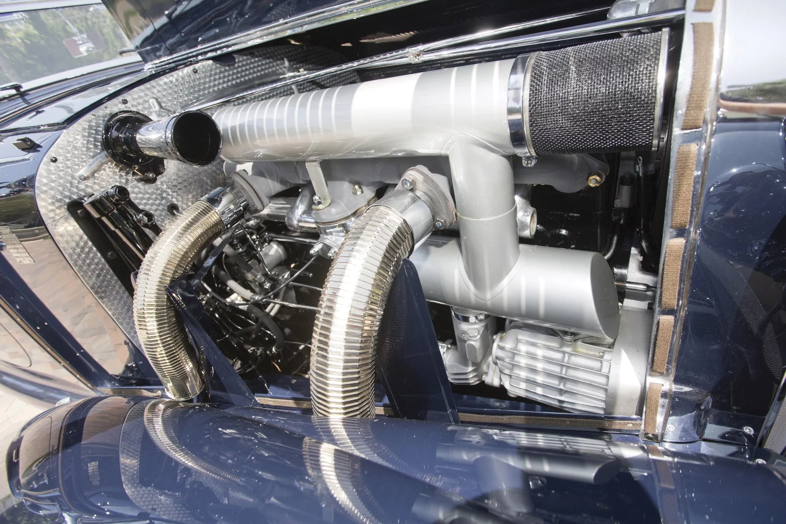 The 540K engine produced 115 bhp without the supercharger engaged and 180 bhp when the compressor clutched in at full throttle, giving it a top speed approaching 110 mph. When tested by Britain's Motor magazine, the 540K hit 102 mph at the end of a quarter-mile. This performance may not seem that impressive today, but this was incredibly fast eighty years ago.