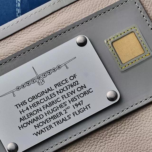 The packaging includes fabric from the Spruce Goose