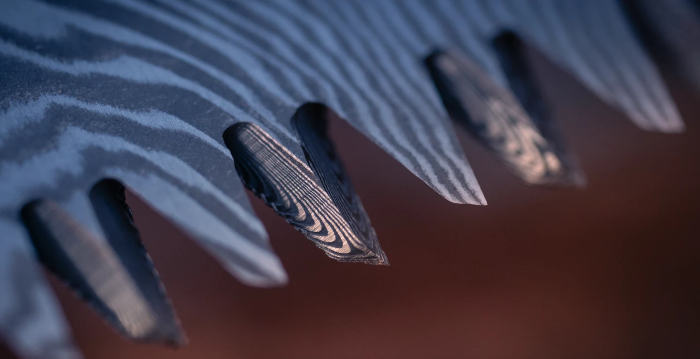 Damascus steel is made from layers of alloys, which create "micro-serrations" on the blades of Woxna's saw, said to help deliver increased cutting power