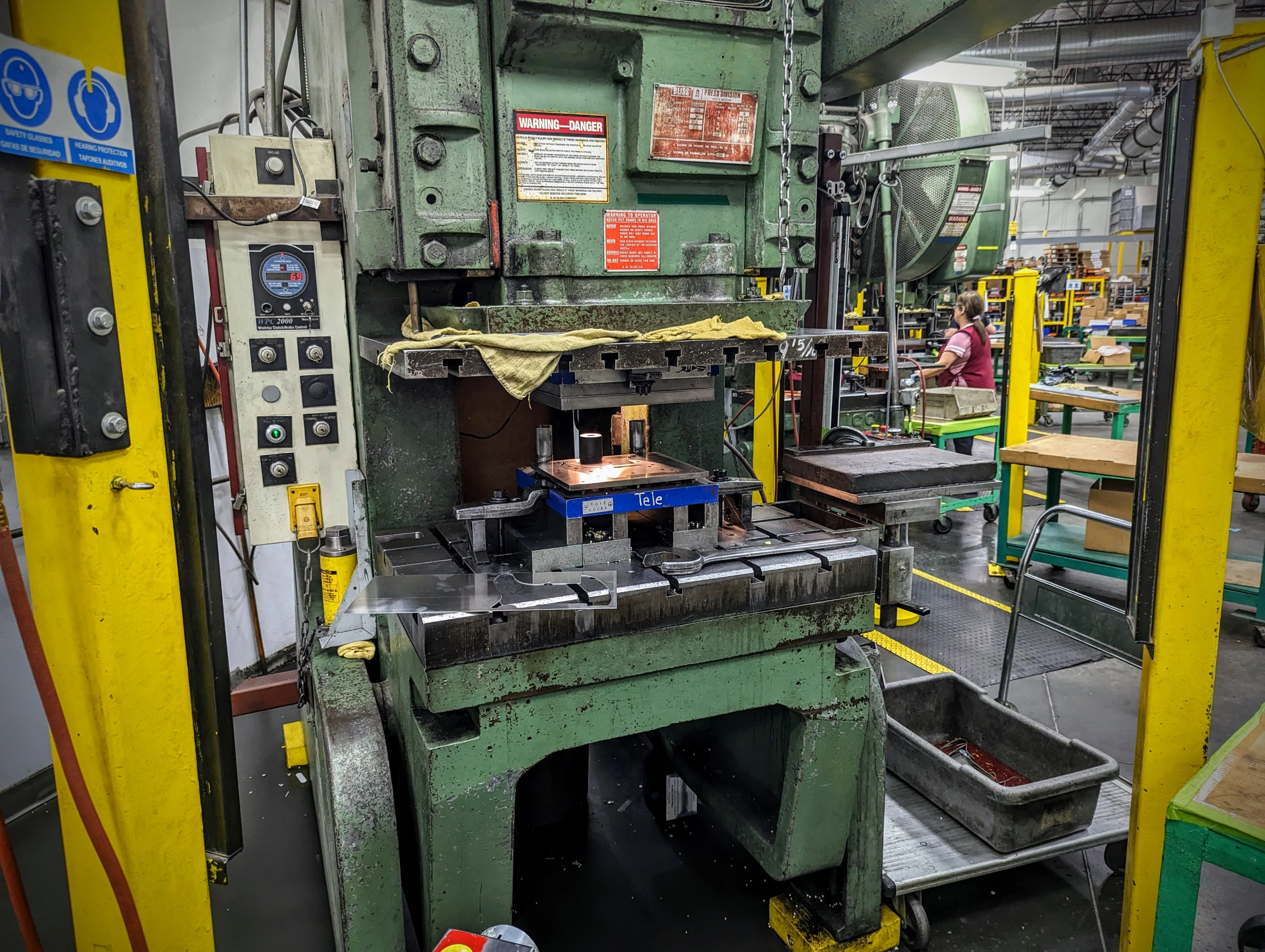 These punch presses have been making Fender parts for longer than anyone's been working at the factory