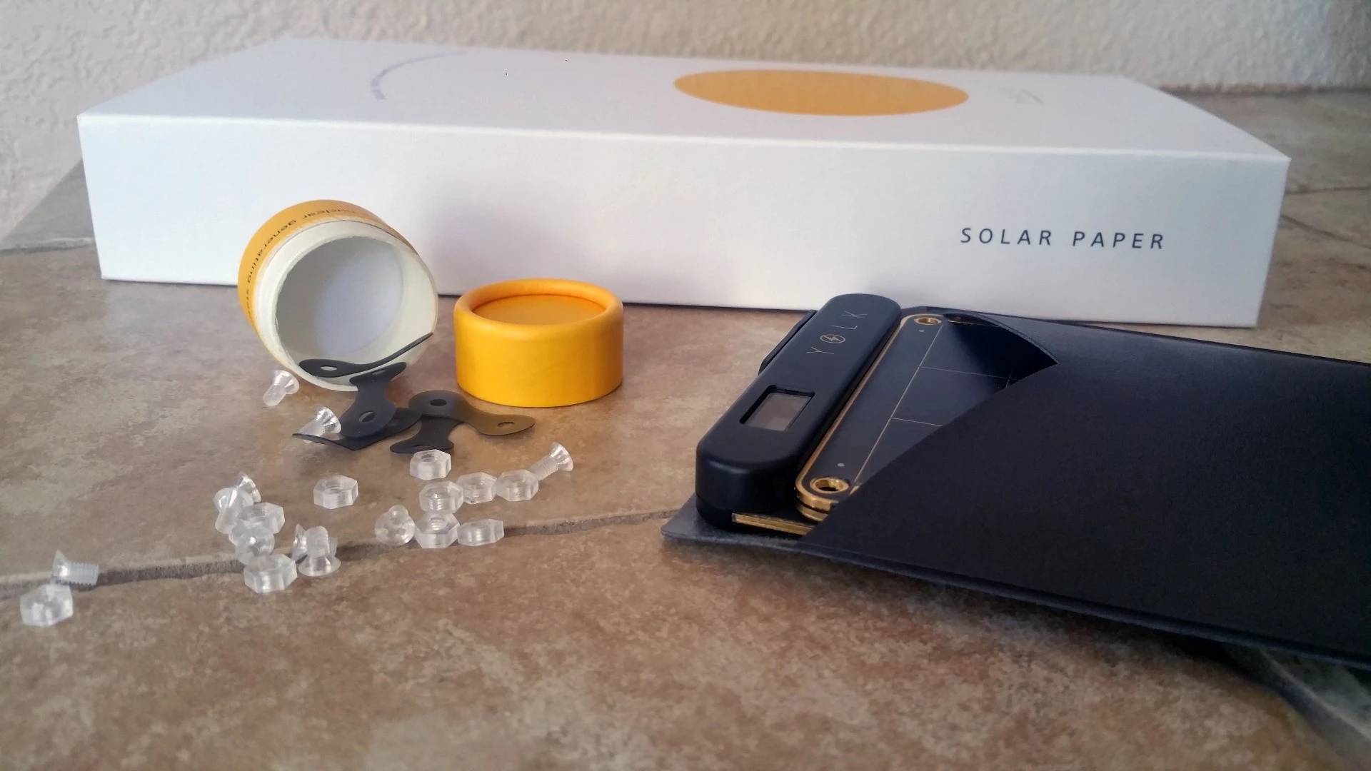 Solar Paper includes an assortment of teeny plastic nuts, bolts, and silicone ‘hinges’ to help safely hang the panels