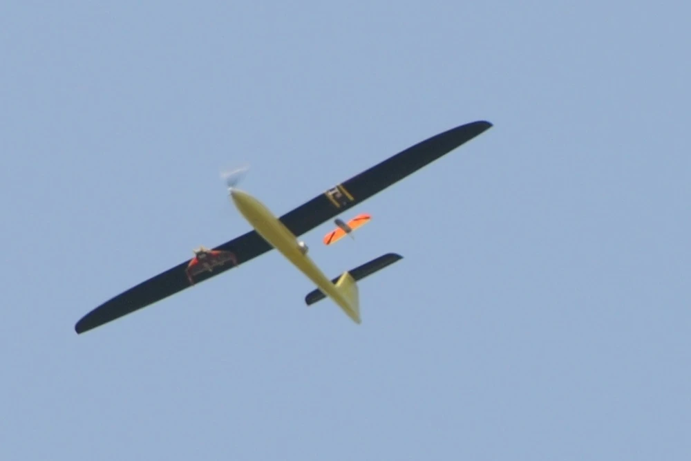 A Tempest UAV, releasing a CICADA UAV from under its left wing