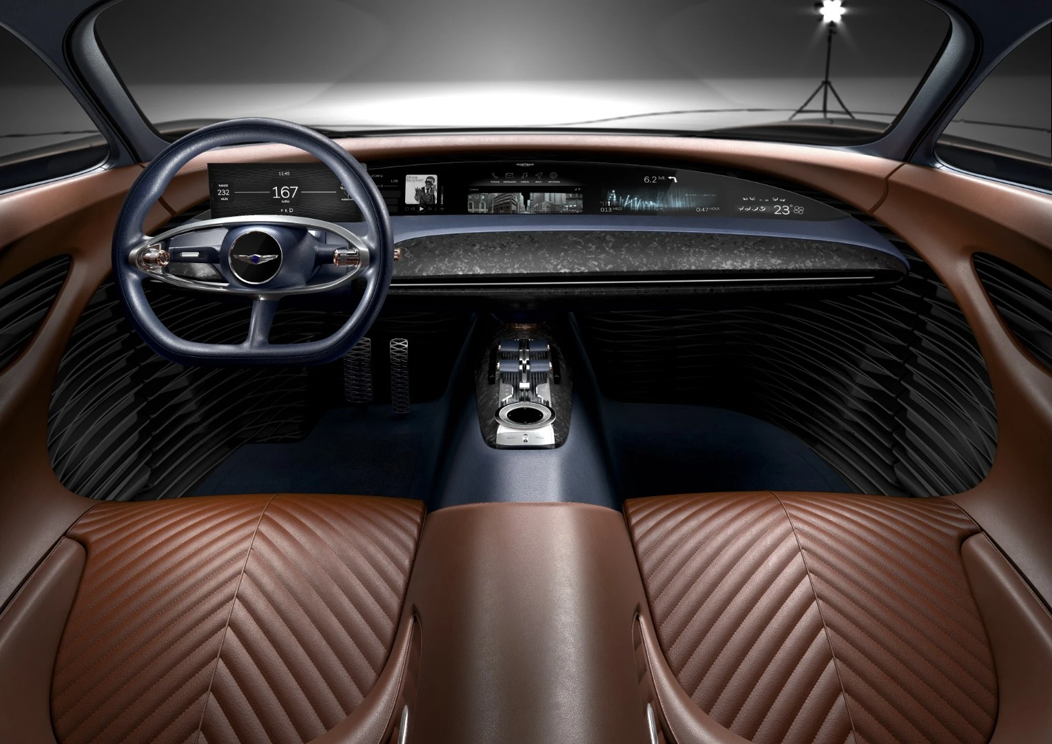 Warm Cognac leather in the Genesis Essentia concept wraps the front occupants while a full-length digital dash keeps them engaged